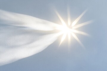 Poster - Light beam with starburst effect on light blue wall.