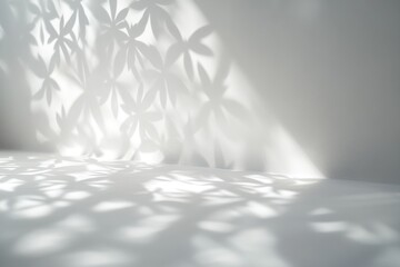 Poster - Light shining through plant-like paper cutouts on a white wall.