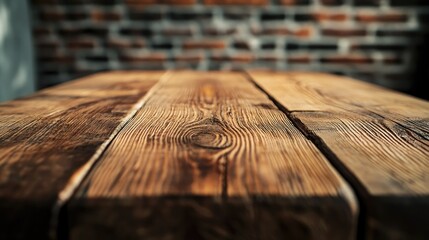 Poster - Close-Up View of Rustic Wooden Table with Detailed Grain Patterns Against a Blurred Brick Background Ideal for Interior Design and Home Decor Themes