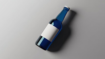 Poster - Blue Glass Beer Bottle Isolated on a Gray Background with Blank Label, Ideal for Beverage Branding and Product Photography Shopping Concepts