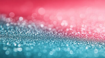 Abstract bokeh background with teal and pink glitter.
