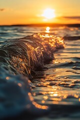Poster - The sun is setting over the ocean, casting a warm glow on the water. The waves are crashing against the shore, creating a peaceful and serene atmosphere
