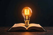 © Alena - Light bulb with book, Idea concept for innovation idea, power of knowledge, power of reading, Self-learning, education knowledge. Internet education course degree, Idea of learning online class
