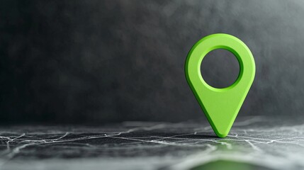 Poster - Green location pin on a dark surface representing navigation and mapping concepts.
