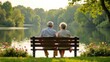 © яна винникова - Elderly couple enjoying a peaceful moment by the lake surrounded by nature in the late afternoon sunlight