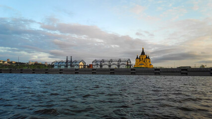 Wall Mural - Nizhny Novgorod, Russia. Spit of Nizhny Novgorod. Cathedral of the Holy Blessed Prince Alexander Nevsky. Warehouses. Sunset Time