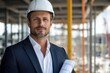 © Milos - A skilled builder in formal attire holds blueprints while sporting a hard hat, embodying a blend of professionalism and dedication to construction excellence.