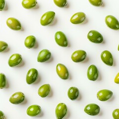 Poster - Fresh green olives arranged on white background forming regular pattern