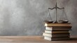 © Vadym - Legal scales balanced on stacked law books symbolize justice, balance. Dimly lit room suggests seriousness, careful consideration. Scene evokes concepts of law, legal principles. Image perfect for