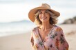 © Igor - Portrait of beautiful mature woman wearing summer dress and hat on the beach