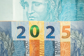 Wall Mural - 2025 in Brazilian reais. Brazil money, Banknotes arranged in the symbol of 2025, Concept, financial analysis, economy of Brazil. close up, Flat lay, Business background