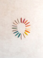 Aufkleber - Circular Arrangement of Multicolored Pencils on Soft Pastel Background