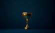 © EFA - A golden trophy on a dark background symbolizing achievement and success.