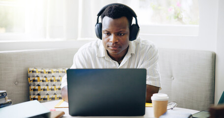 Leinwandbilder - Black man, student and headphones with laptop, home or reading with e learning, scholarship or online course. Person, notes and books with video, education or listening for college project in house