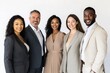 © Isuru - A diverse group of smiling business professionals stand together, showcasing teamwork and inclusivity.