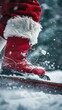 © OLGA - Closeup of red Santa boots on snowboard, winter snow splashing around, outdoor festive scene, holiday spirit concept