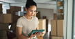© peopleimages.com - Woman, tablet and typing in business for logistics, order process and package checklist in office. Entrepreneur, tech and app in warehouse for inventory management, supply chain or boxes for delivery