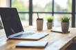 © atar - Modern workspace with laptop, coffee cups, and plants. Concept of productivity, work from home, and modern office.