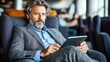 © Munlika - Focused office worker using a tablet, representing modern productivity tools and the importance of technology in business operations and decision-making.