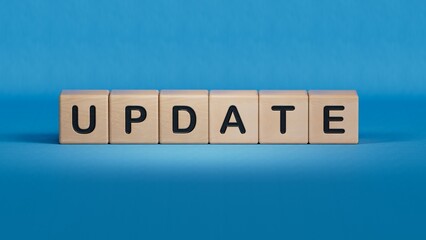 wooden cube with word update. Investment in life insurance and healthcare concept.close up of wooden elements,Business Concept.3D rendering on blue background.