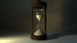 © Thirakun - Hourglass with sand flowing through measuring time before the deadline with empty space for copy