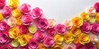 © lapeepon - Vibrant pink and yellow paper rose flowers scattered on a white background , yellow, decorative,  yellow, decorative, blossoms