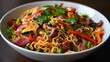 © Thirakun - Spicy instant noodle salad with colorful vegetables and assorted meats