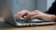 © eraStocks  - Close-up of Hands Typing on a Laptop Keyboard, Modern Workspace, Productive Remote Work Concept, Business and Technology Focus