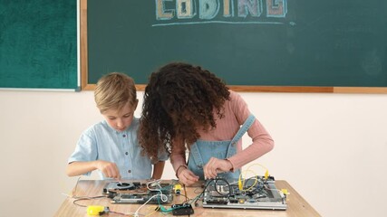 Poster - smart girl standing while fixing electronic board by using screwdriver. happy student and happy cauc