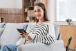 © Pixel-Shot - Young girl reading e-book at home