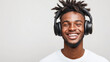 © Atmospheric stock - Smiling african young male with headphones