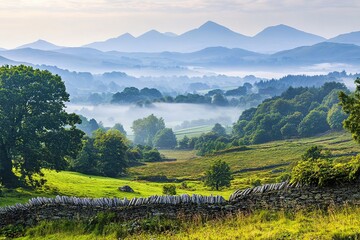 Poster - scenic view of rolling hills and misty mountains in distance with foreground in focus and background blurred plenty