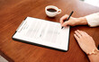 © Koegelenberg/peopleimages.com - Office, hands and person with document for signature, business agreement and corporate policy on desk. Above, employee and accountant with contract for compliance, application and approval for deal