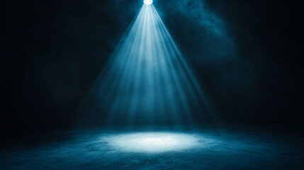 Poster - Dramatic spotlight illuminating a dark stage with soft blue tones. 