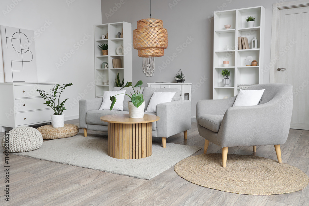 Interior of light living room with sofa, coffee table and shelf units