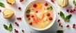 © Ari - Fruit soup with starfruit, lychee, and red currants, styled for a food magazine photoshoot, bright and glossy