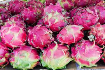 Wall Mural - Fresh dragon fruit close up, side, front and top view. This photo is ideal for use in poster designs, greeting cards, or as an illustration for articles about fruits.