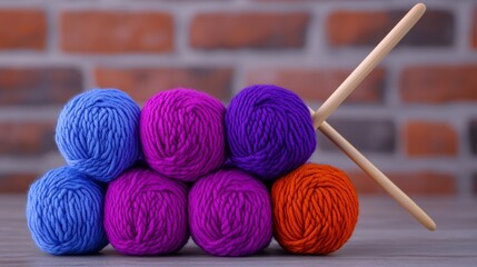 Poster - Pile of colorful yarn and a knitting needle. The yarn is purple, blue, and orange