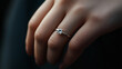 © Kevin - Elegant diamond ring on a woman's hand with a dark background