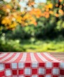 © ANZ studio - Red checkered tablecloth on wooden table outdoors.