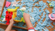 © VerraWidhi - Little Boy Playing with Blue Kinetic Sand at Home. Early Education. Preparing for School. Development