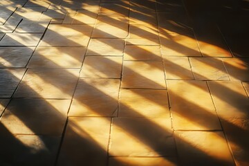 Poster - Warm golden light gracefully fades into shadows across textured tiles, creating a serene atmosphere in an intimate setting during early evening