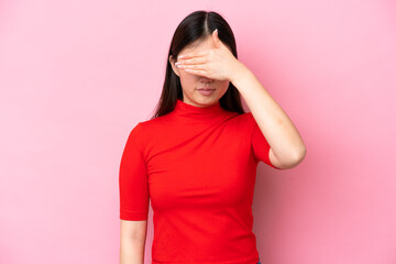 Wall Mural - Young Chinese woman isolated on pink background covering eyes by hands. Do not want to see something