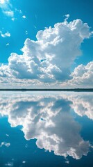 Wall Mural - Reflections of fluffy clouds on a calm lake surrounded by lush green trees under a bright blue sky