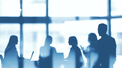 Poster - Business Professionals Engaged in Discussion During a Meeting in a Modern Office Setting With Large Windows Allowing Natural Light