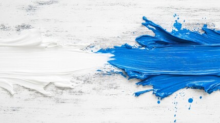 Wall Mural - A blue and white paint splatter on a white wooden surface