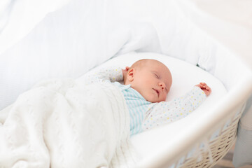 Wall Mural - Cute newborn baby in white bed