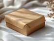 © AI Vision Studio - Brown craft paper box on the table for design.