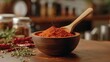 © Plaifah - Vibrant Red Spice Powder in Wooden Bowl on Rustic Kitchen Counter