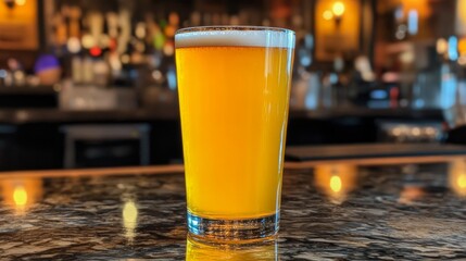 Poster - Refreshing Glass of Golden Beer on Bar Counter with Soft Lighting